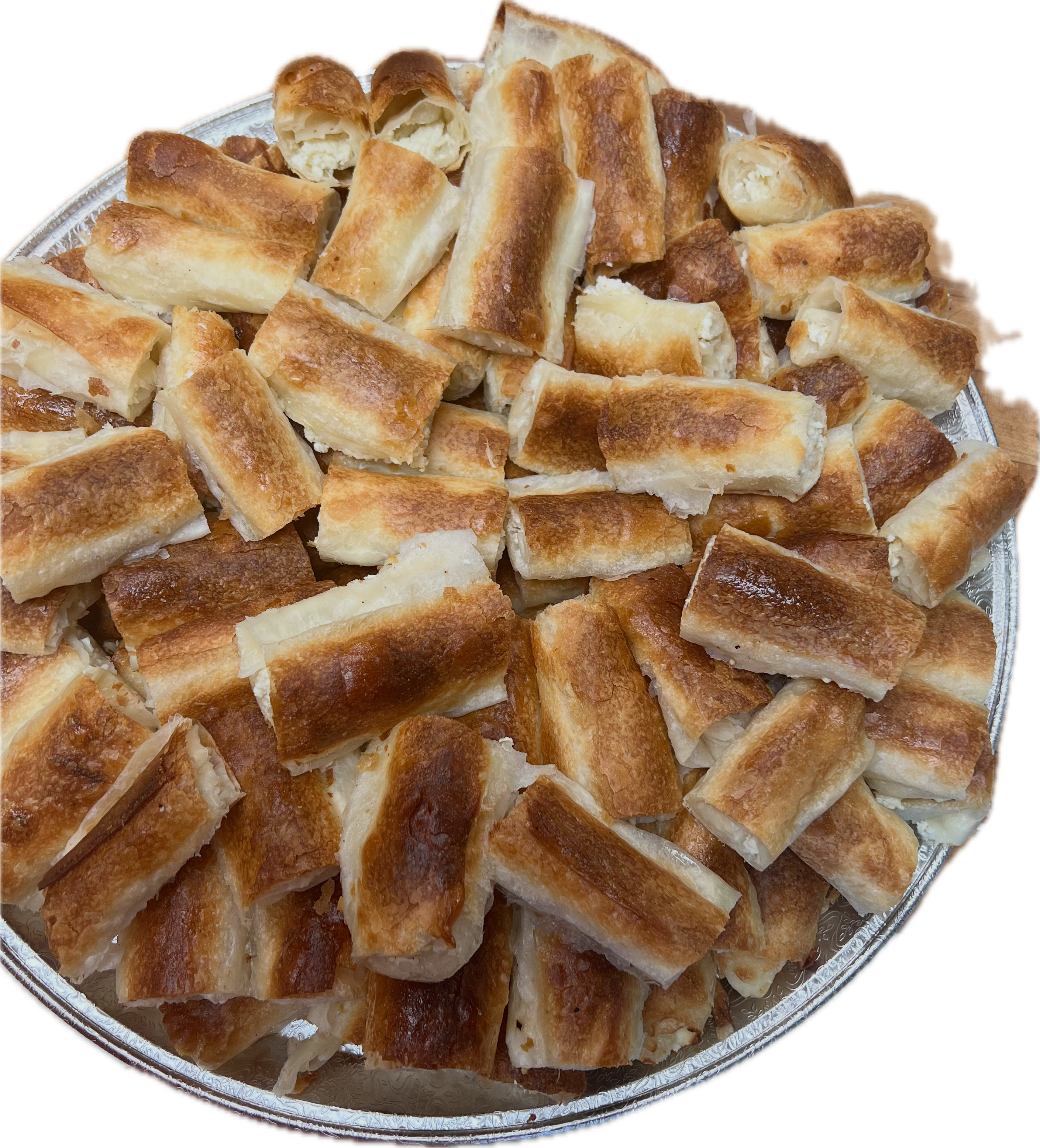 Tray of hand-stretched burek cut into squares